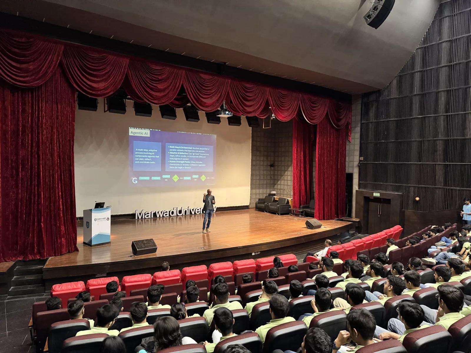 Ritesh Vajariya on stage at a full-hall workshop at Marwadi University, India